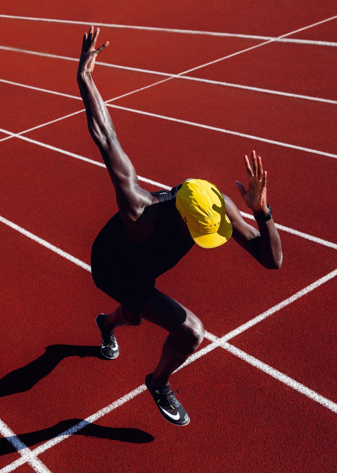 Runner exploding out of the blocks on a red track. The athletes Continuum Health and Performance is built for.